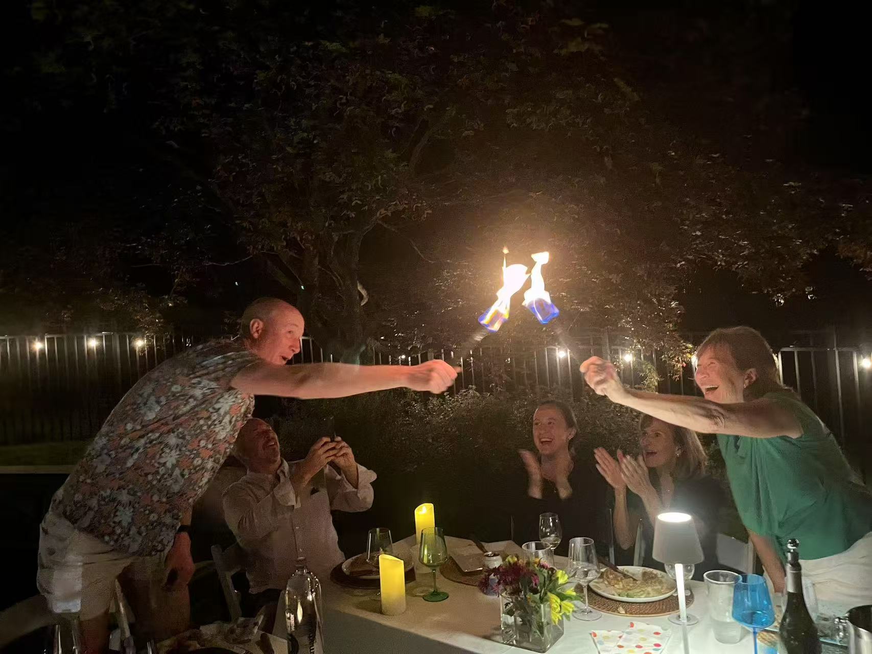 Real chef fire performance at an evening hibachi dinner party